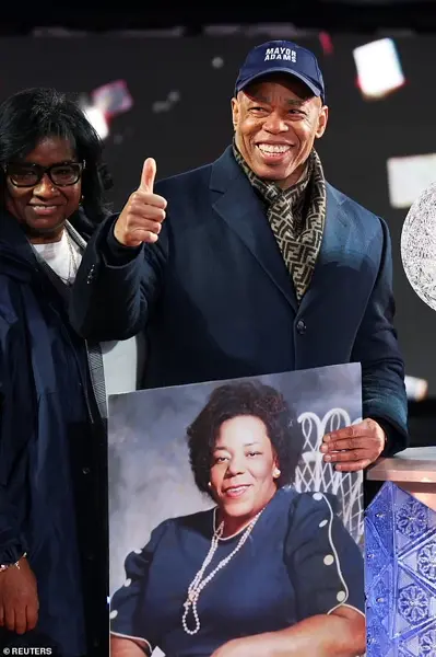 Glowing in the Cold: Times Square Revelers Celebrate New Year's Eve with Novelty Glasses and Unyielding Spirit