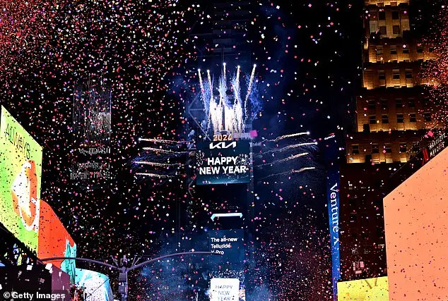 Glowing in the Cold: Times Square Revelers Celebrate New Year's Eve with Novelty Glasses and Unyielding Spirit