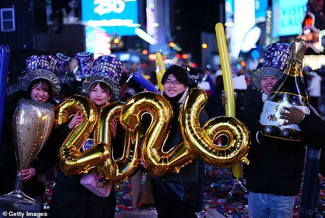 Glowing in the Cold: Times Square Revelers Celebrate New Year's Eve with Novelty Glasses and Unyielding Spirit