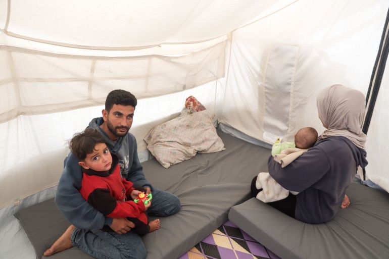 Gazans rely on phone torches for light after war destroys power grid.