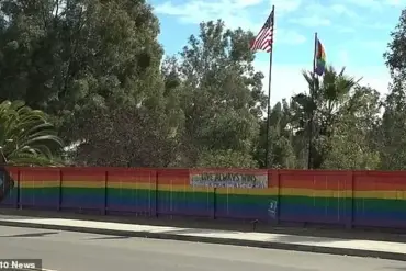 Lesbian woman discovers hateful teen group vandalizing her pride fence