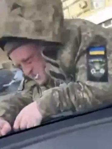 TEC Employee Ends Up On Hood Of Car During Military Service Confrontation